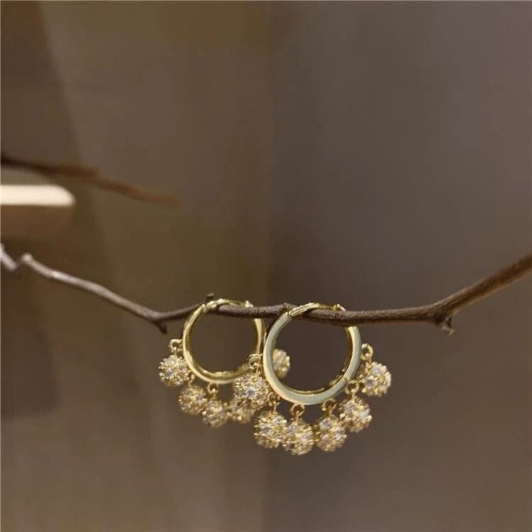 Aretes de borlas con diamantes incrustados